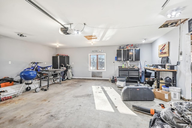 garage featuring a workshop area and a garage door opener