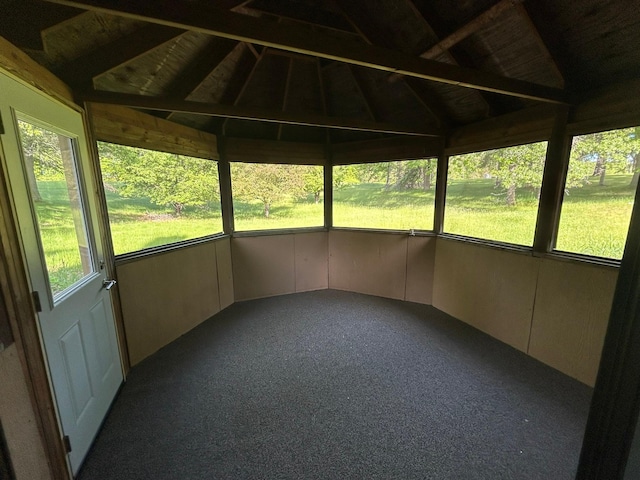 unfurnished sunroom with lofted ceiling