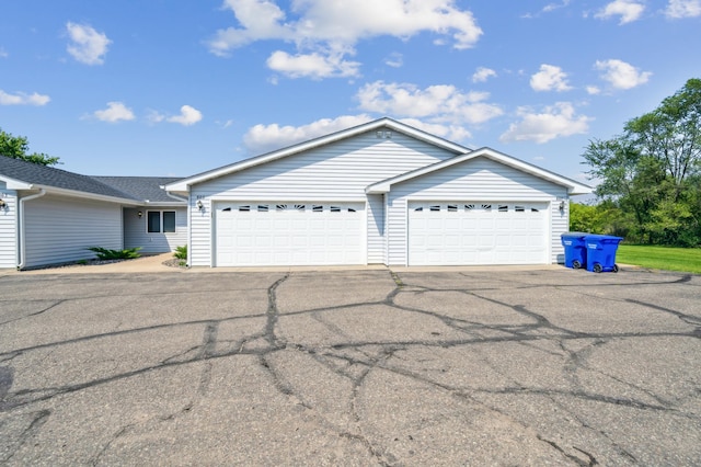 single story home featuring a garage