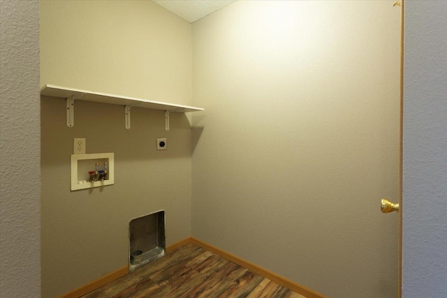 laundry area featuring dark hardwood / wood-style flooring, washer hookup, and hookup for an electric dryer