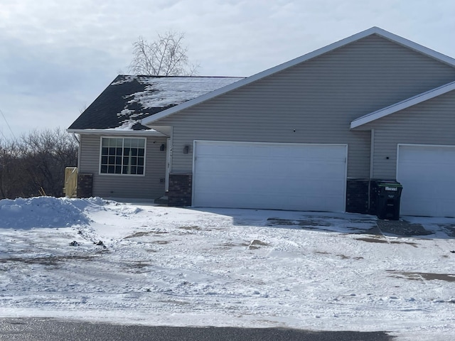 ranch-style house featuring a garage