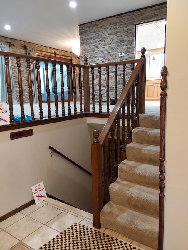 staircase featuring tile patterned floors