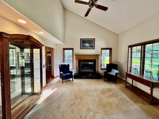 unfurnished room featuring light carpet, high vaulted ceiling, and ceiling fan