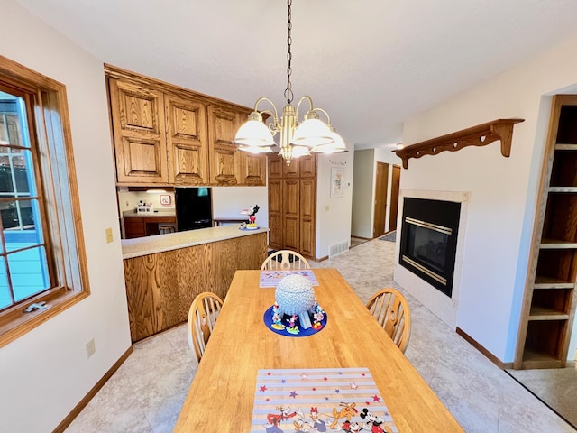 dining space featuring an inviting chandelier