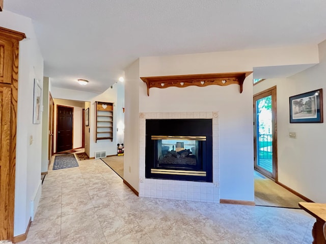 unfurnished living room featuring a fireplace