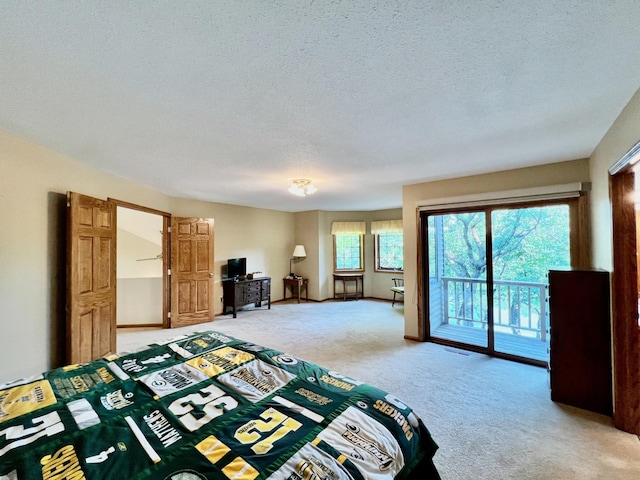 unfurnished bedroom with access to outside, carpet floors, and a textured ceiling