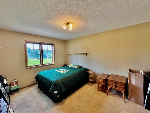 carpeted bedroom with a textured ceiling