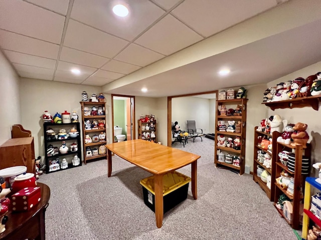 office area with a paneled ceiling and carpet floors