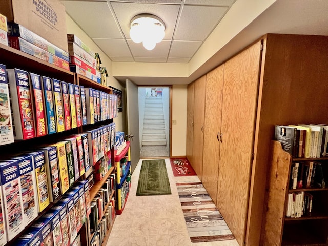 hallway with a drop ceiling