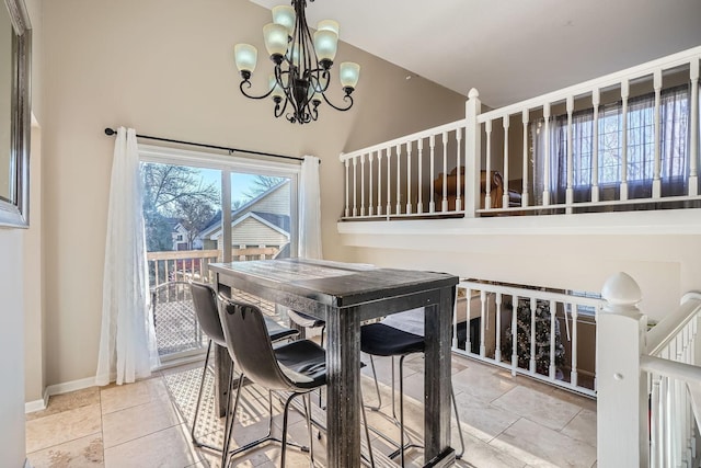 dining space featuring a notable chandelier and light tile patterned flooring