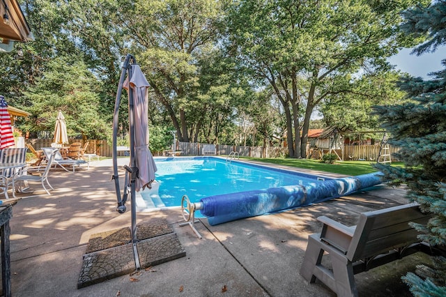 view of swimming pool featuring a patio area