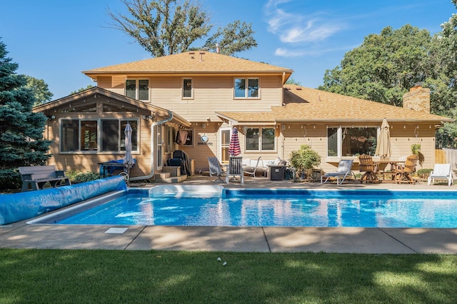 view of swimming pool featuring a patio area