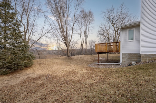 yard at dusk with a wooden deck