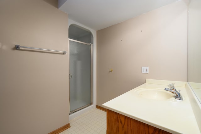 bathroom with vanity and an enclosed shower