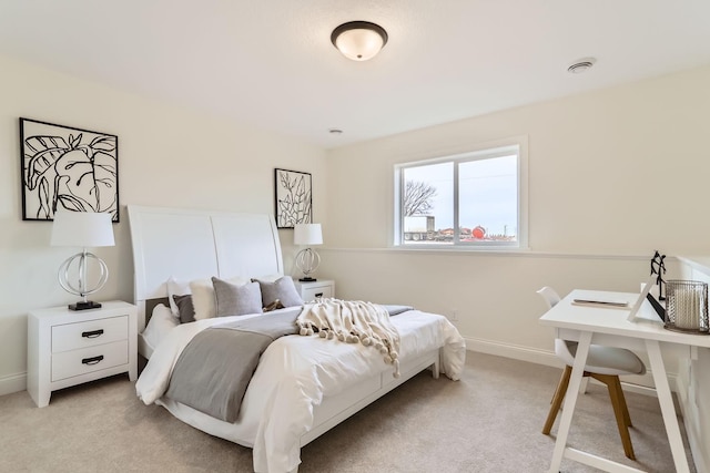 bedroom with light colored carpet