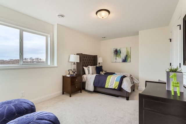 bedroom featuring light carpet