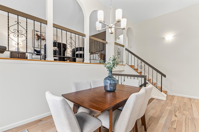 dining space with an inviting chandelier and light wood-type flooring