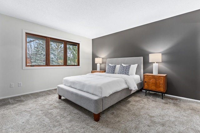 carpeted bedroom with a textured ceiling