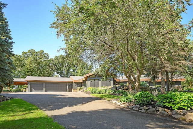 ranch-style house featuring a garage