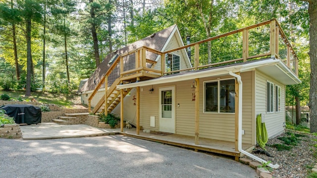 back of property featuring a patio area