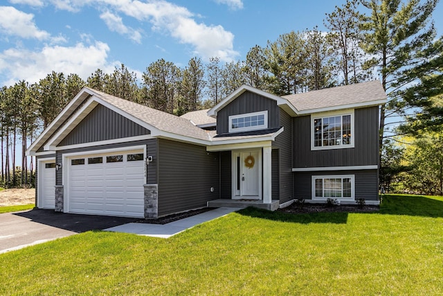 view of front of home featuring a garage and a front lawn