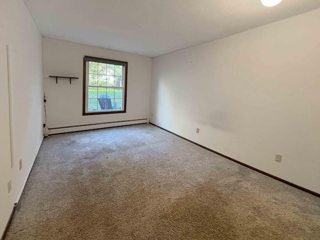 unfurnished room featuring carpet flooring and a baseboard radiator