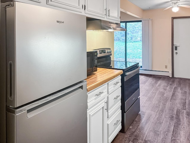 kitchen with white cabinetry, ceiling fan, baseboard heating, ventilation hood, and appliances with stainless steel finishes