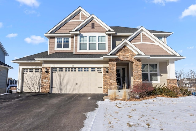 craftsman house with a garage