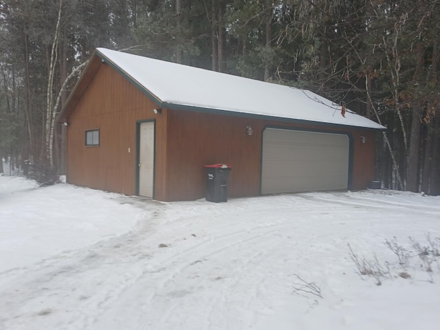 view of snow covered garage