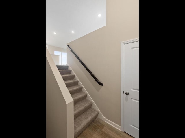 staircase featuring hardwood / wood-style flooring