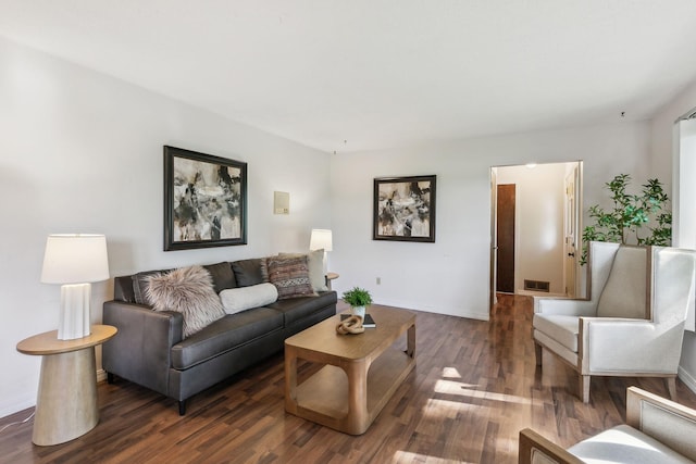 living room featuring dark wood-type flooring