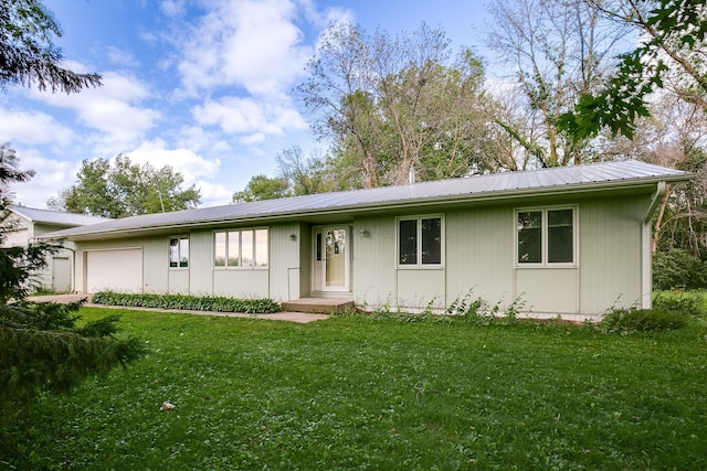 single story home featuring a front yard and a garage