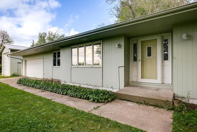 view of exterior entry featuring a garage