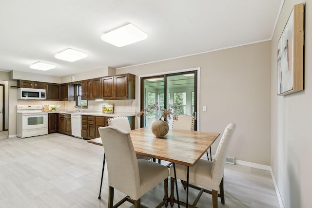 dining room with a healthy amount of sunlight and sink