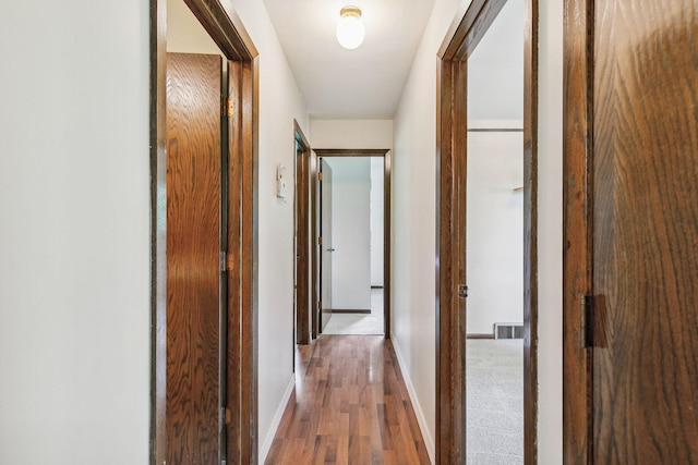 hallway featuring hardwood / wood-style floors