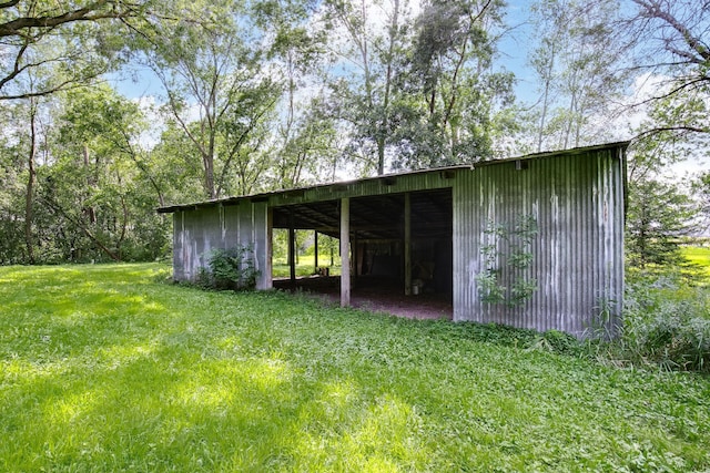 view of outdoor structure with a lawn