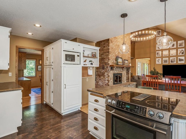 kitchen featuring white cabinetry, dark wood-type flooring, pendant lighting, and electric range