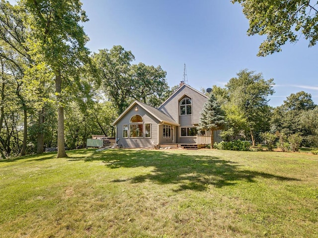 back of house with a yard