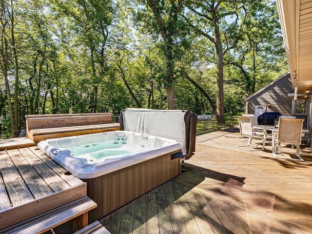 deck with a covered hot tub