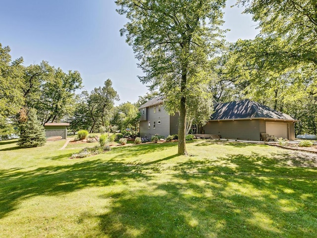 view of yard featuring a garage