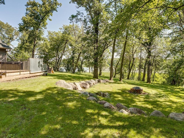 view of yard with an outdoor fire pit