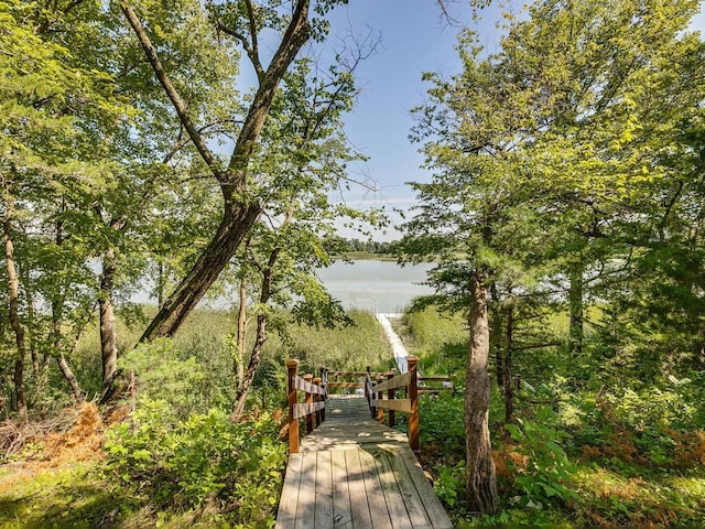 surrounding community featuring a water view