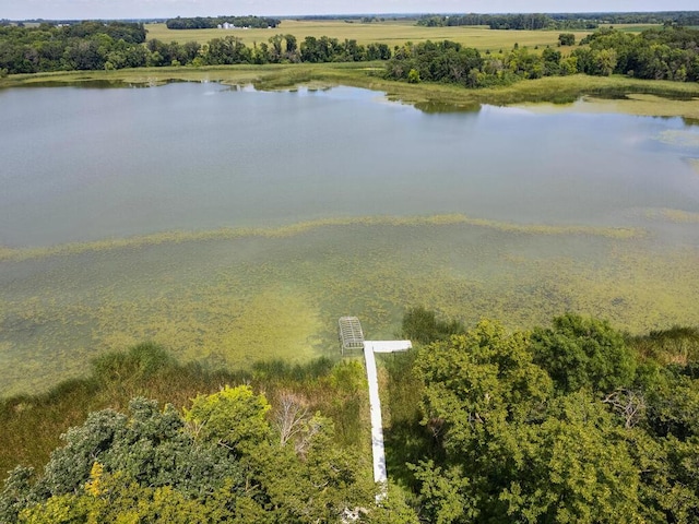 drone / aerial view featuring a water view and a rural view