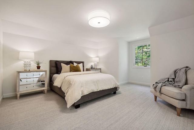 bedroom with light colored carpet