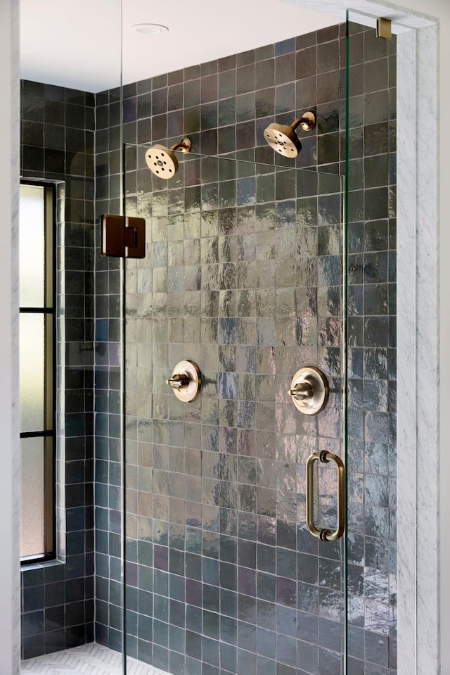 bathroom with a shower stall