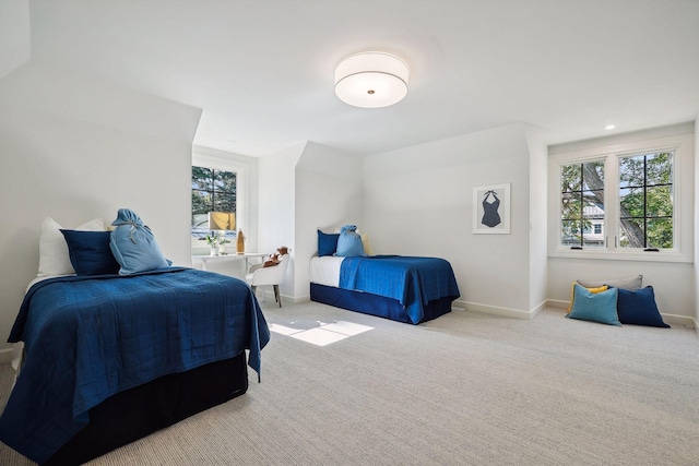 bedroom featuring light carpet