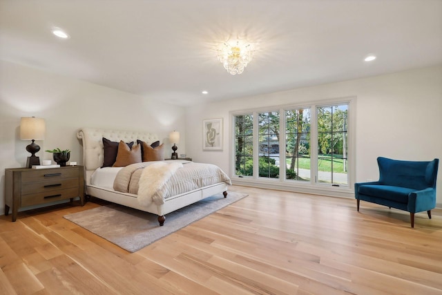 bedroom with recessed lighting and light wood-style floors