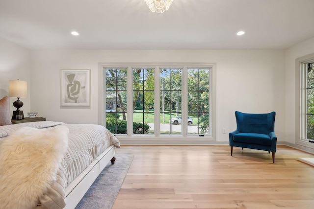 bedroom with recessed lighting, baseboards, and light wood finished floors