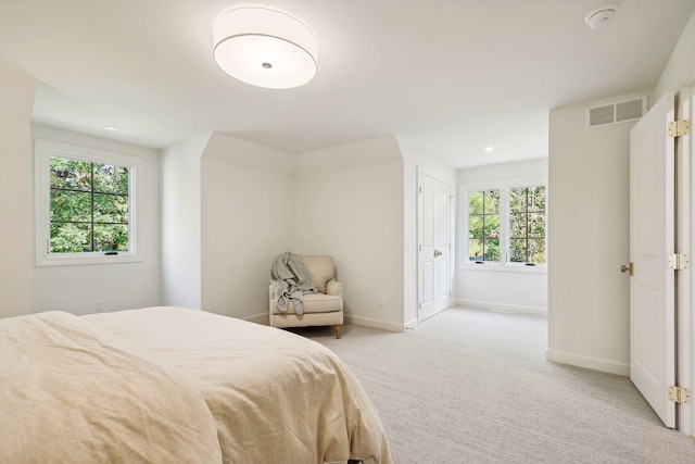 bedroom with recessed lighting, visible vents, baseboards, and light colored carpet