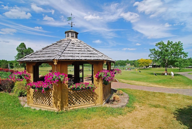 view of property's community with a gazebo and a yard